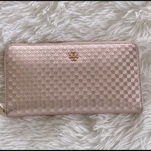 Tory Burch
Rose Gold Marion Metallic Embossed Zip Around Wallet
7"L x 1"W x 4"H
